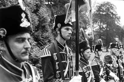 ...in toy-soldier uniforms